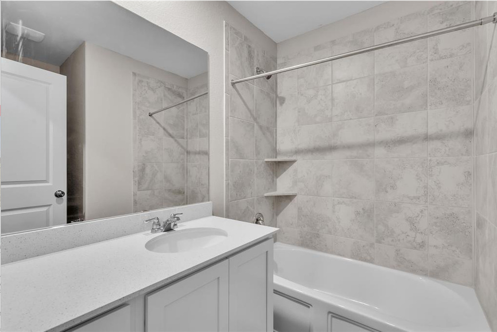 240 Madrid Kyle, TX 78640 - Photo 10 of 25 Bathroom featuring vanity and shower / bath combination