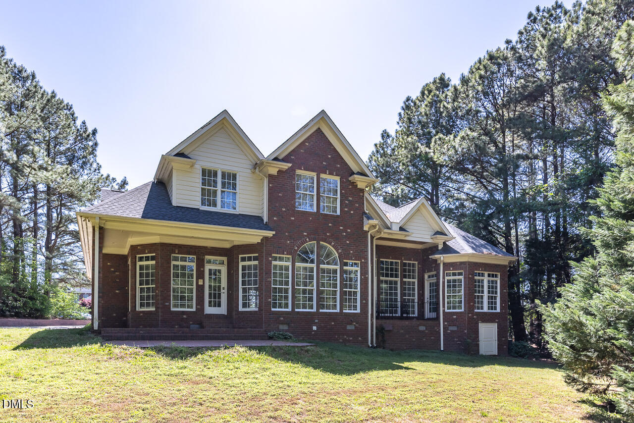4004 Frontenac Court Apex, NC 27539 - Photo 56 of 61 a front view of a house with a yard