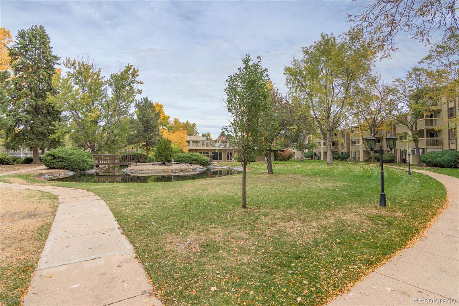 1304 South Parker Road, Unit 347 Denver, CO 80231 - Photo 18 of 27 a view of a garden with palm trees