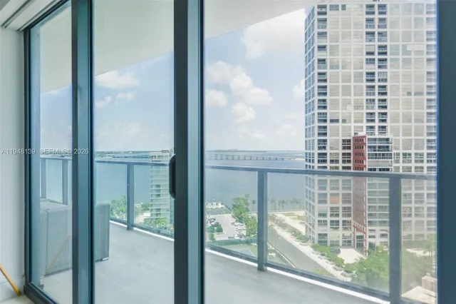a bathroom with a bathtub shower sink and mirror