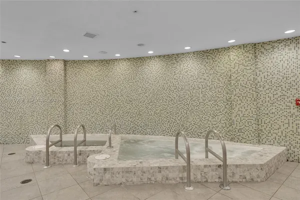 a bathroom with a tub and a sink