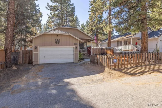 a front view of a house with a garage