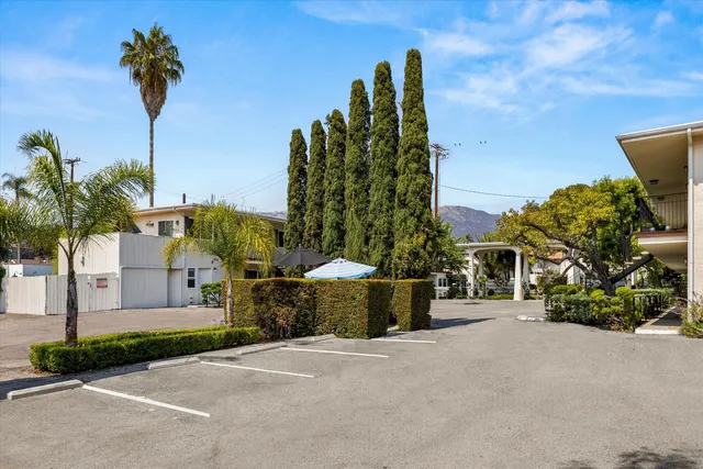 a view of a street with a building in the background