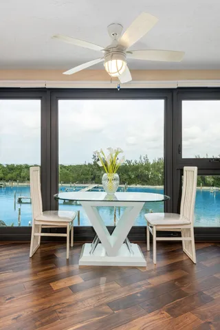 a living room with couch and a floor to ceiling window