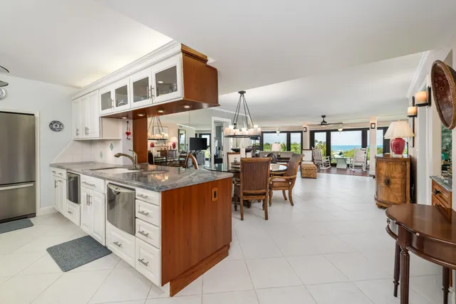 a kitchen with stainless steel appliances granite countertop a stove and a refrigerator