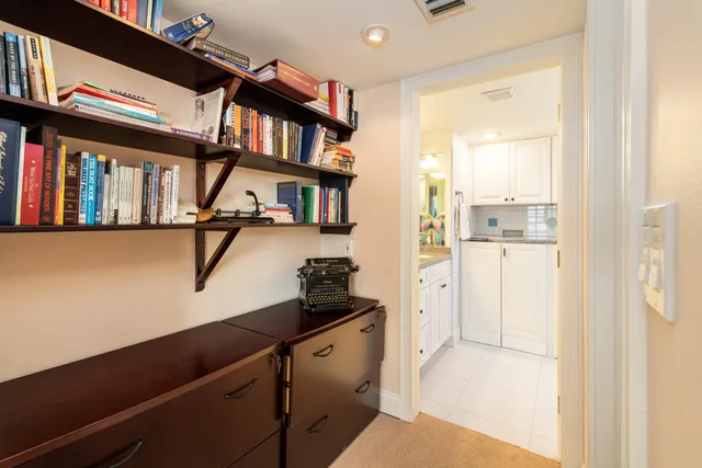 a bedroom with a bed and a television