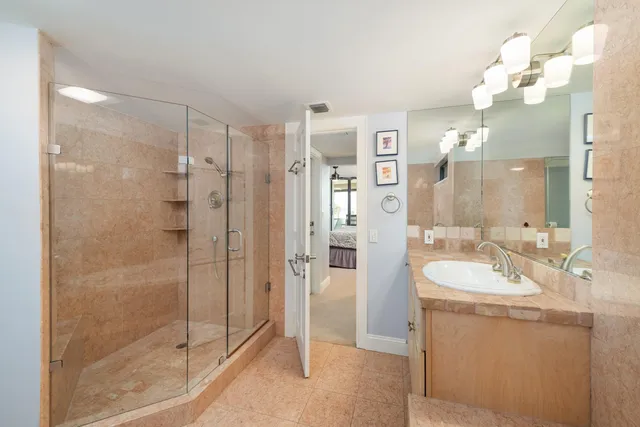 a bathroom with a double vanity sink and a mirror