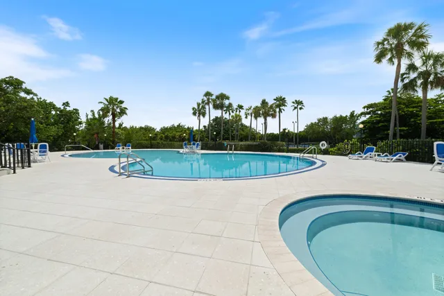 a view of a swimming pool with a yard