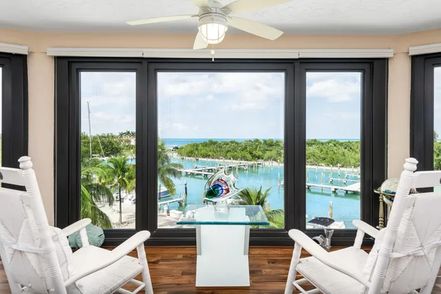 a living room with a large window and a table