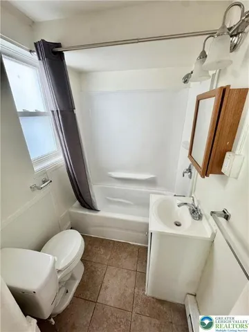 a bathroom with a toilet and a sink