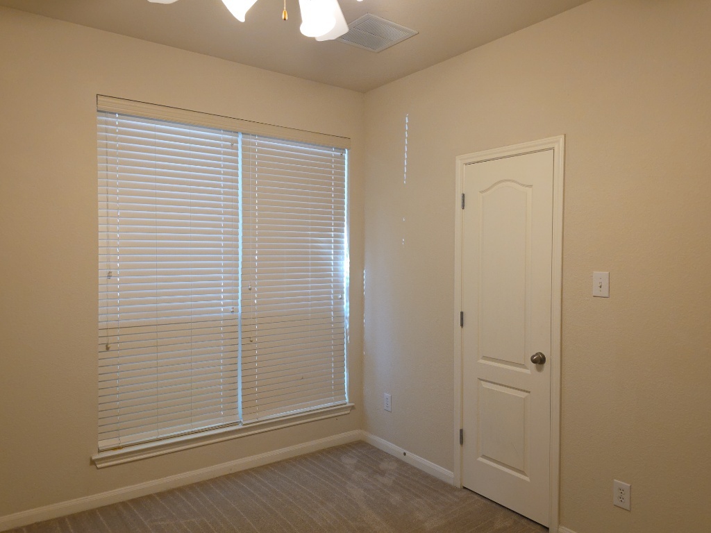 2103 Spotted Owl Circle Pflugerville, TX 78660 - Photo 17 of 24 an empty room with windows