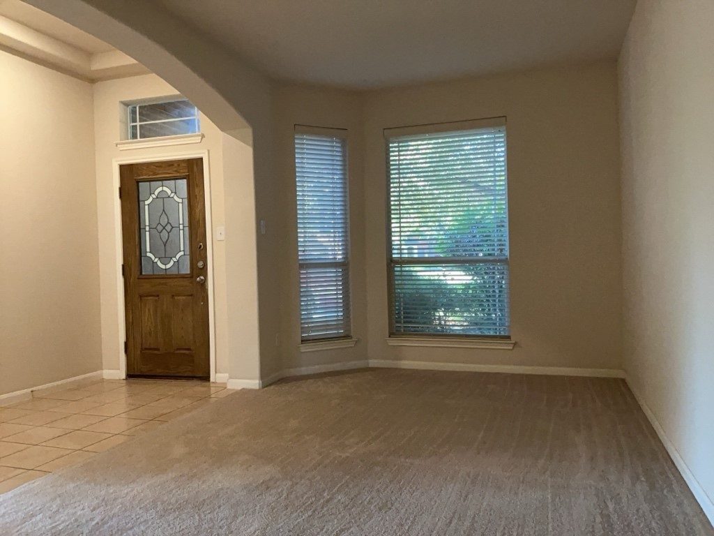 2103 Spotted Owl Circle Pflugerville, TX 78660 - Photo 4 of 24 an empty room with windows and closet
