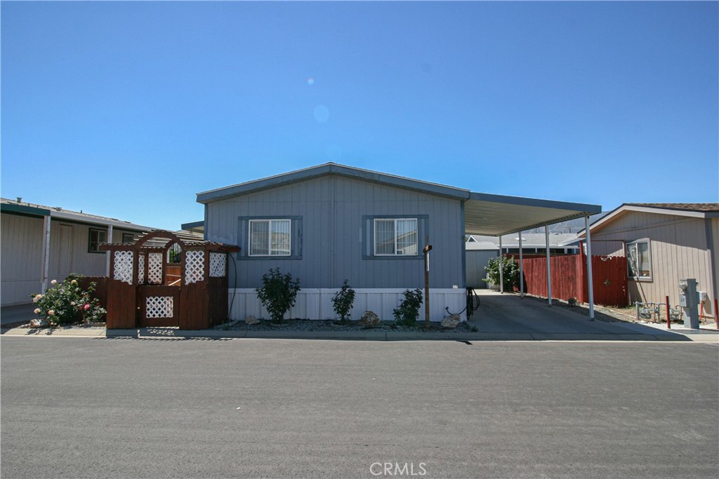 600 South Dennison Road, Unit 27 Tehachapi, CA 93561 - Photo 1 of 1 a front view of a house with a yard