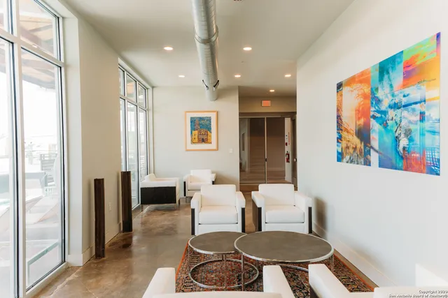 a living room with furniture and a rug