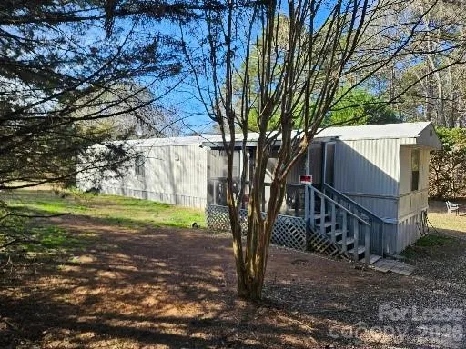 a view of backyard with green space