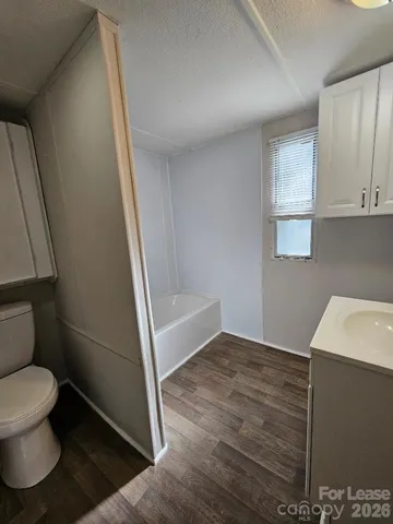 a bathroom with a toilet and a sink