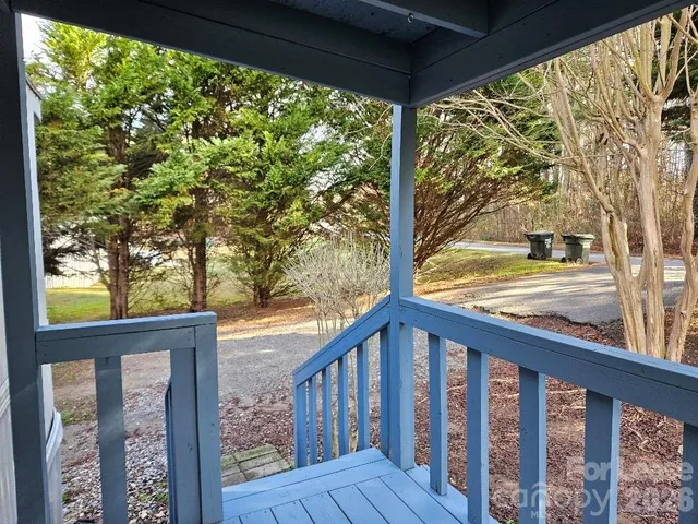 a view of a balcony with wooden floor