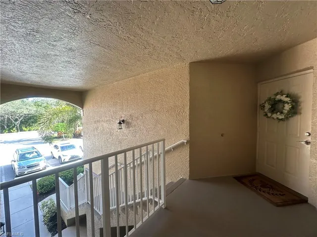 a view of a hallway with windows