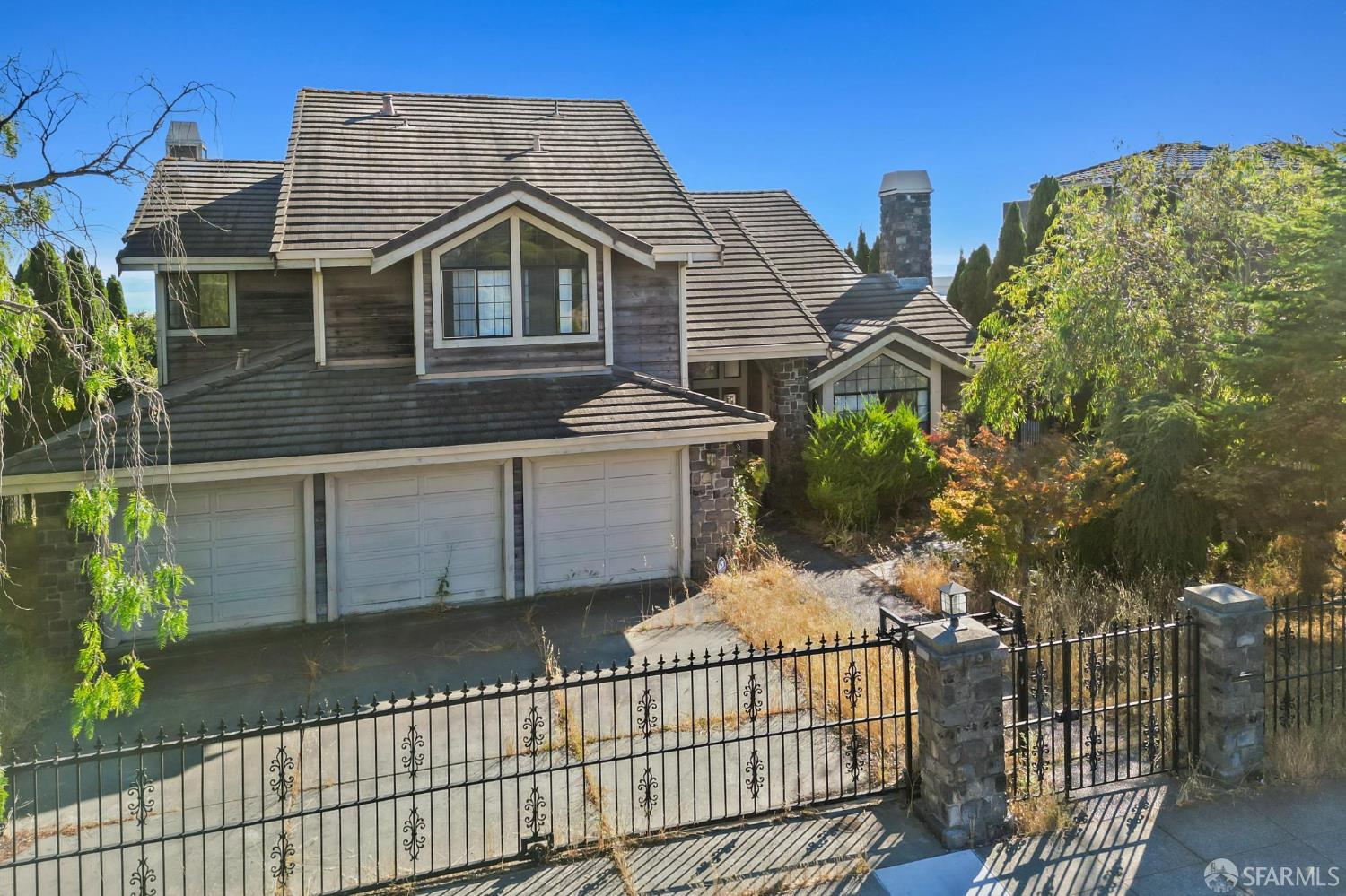 13407 Campus Drive Oakland, CA 94619 - Photo 2 of 13 a view of a house with wooden fence