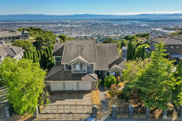 an aerial view of a house with a garden