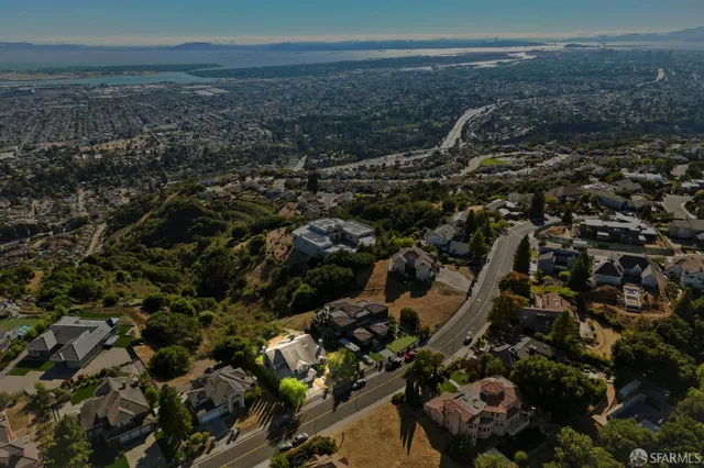 an aerial view of multiple houses with outdoor space