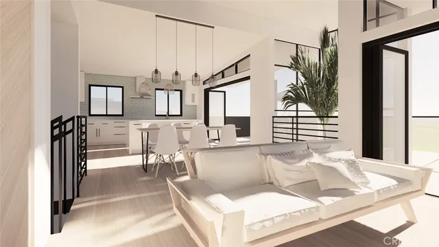 a living room with stainless steel appliances kitchen island granite countertop furniture and a kitchen view