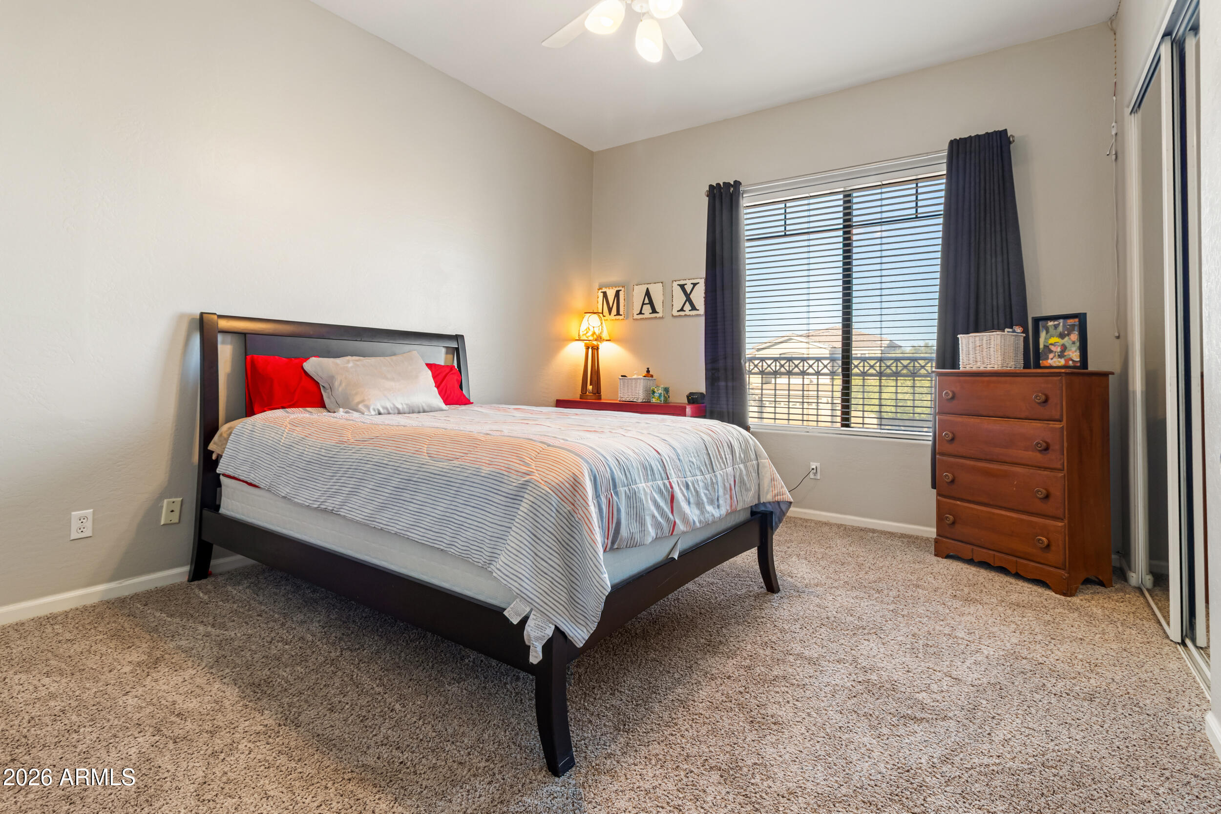 5219 East Hashknife Road Phoenix, AZ 85054 - Photo 20 of 38 a bedroom with a bed and a dresser