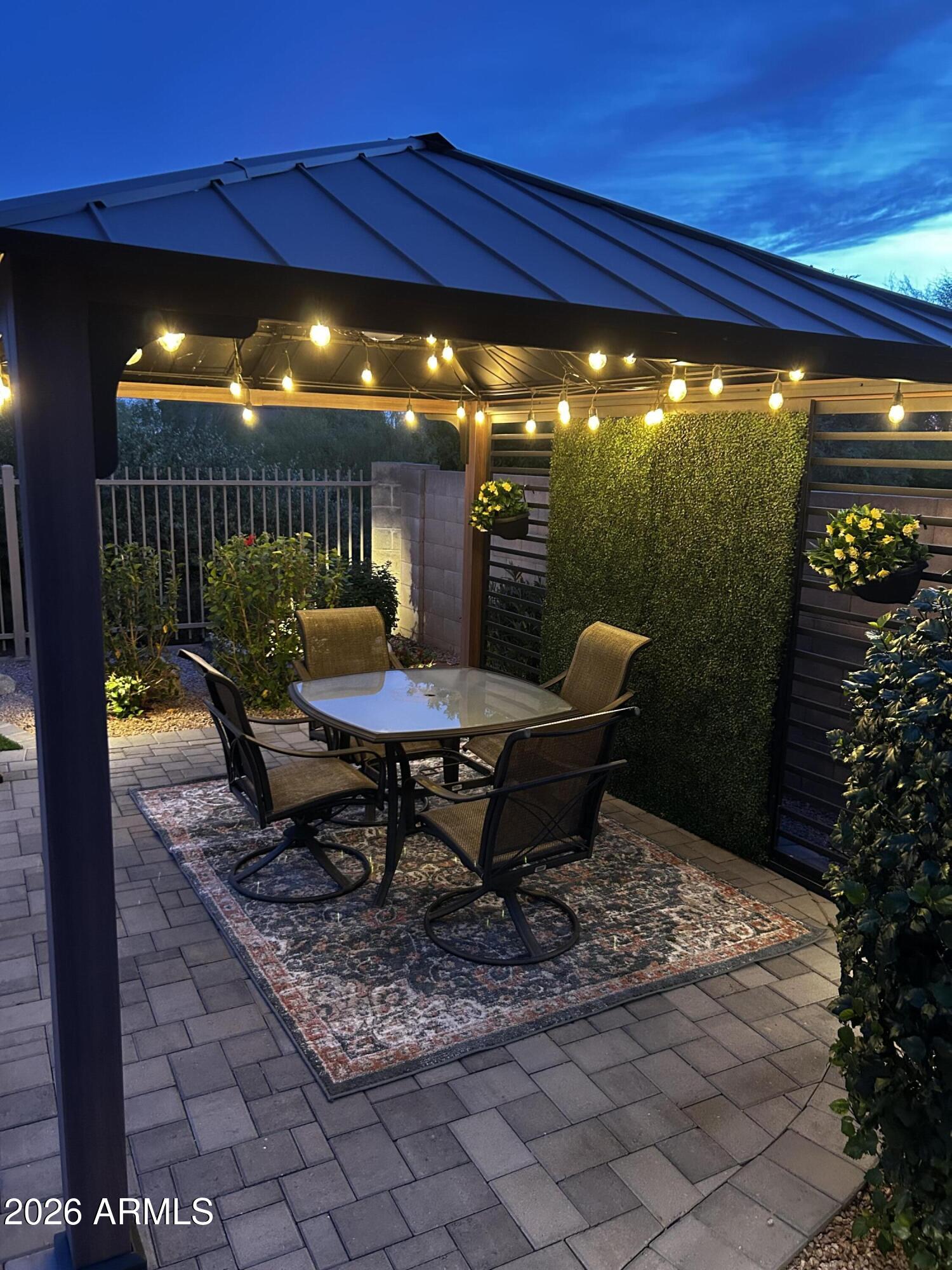 5219 East Hashknife Road Phoenix, AZ 85054 - Photo 29 of 38 a patio with table and chairs