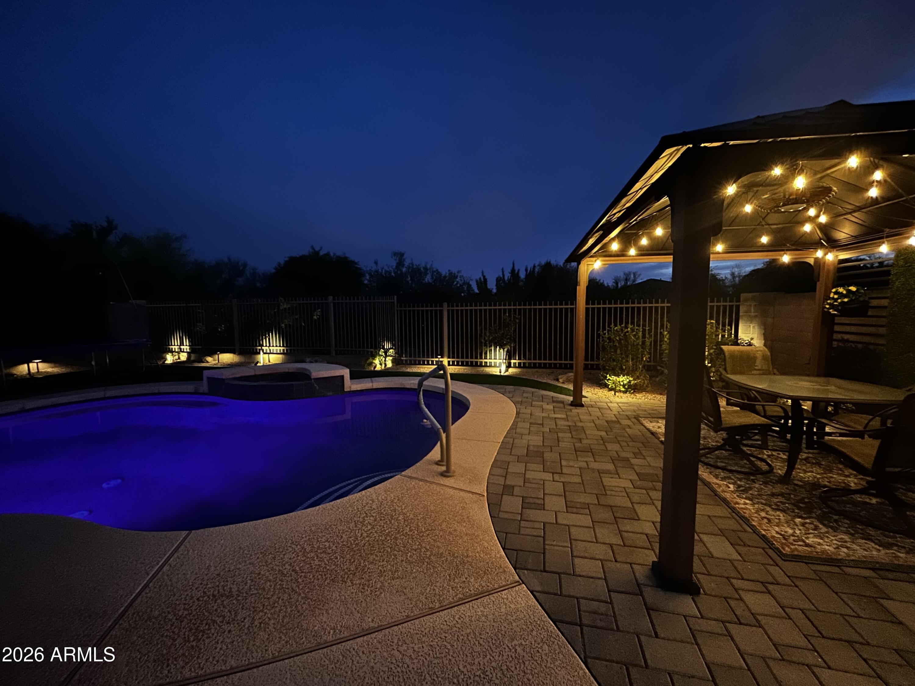 5219 East Hashknife Road Phoenix, AZ 85054 - Photo 31 of 38 a view of a swimming pool with sitting area
