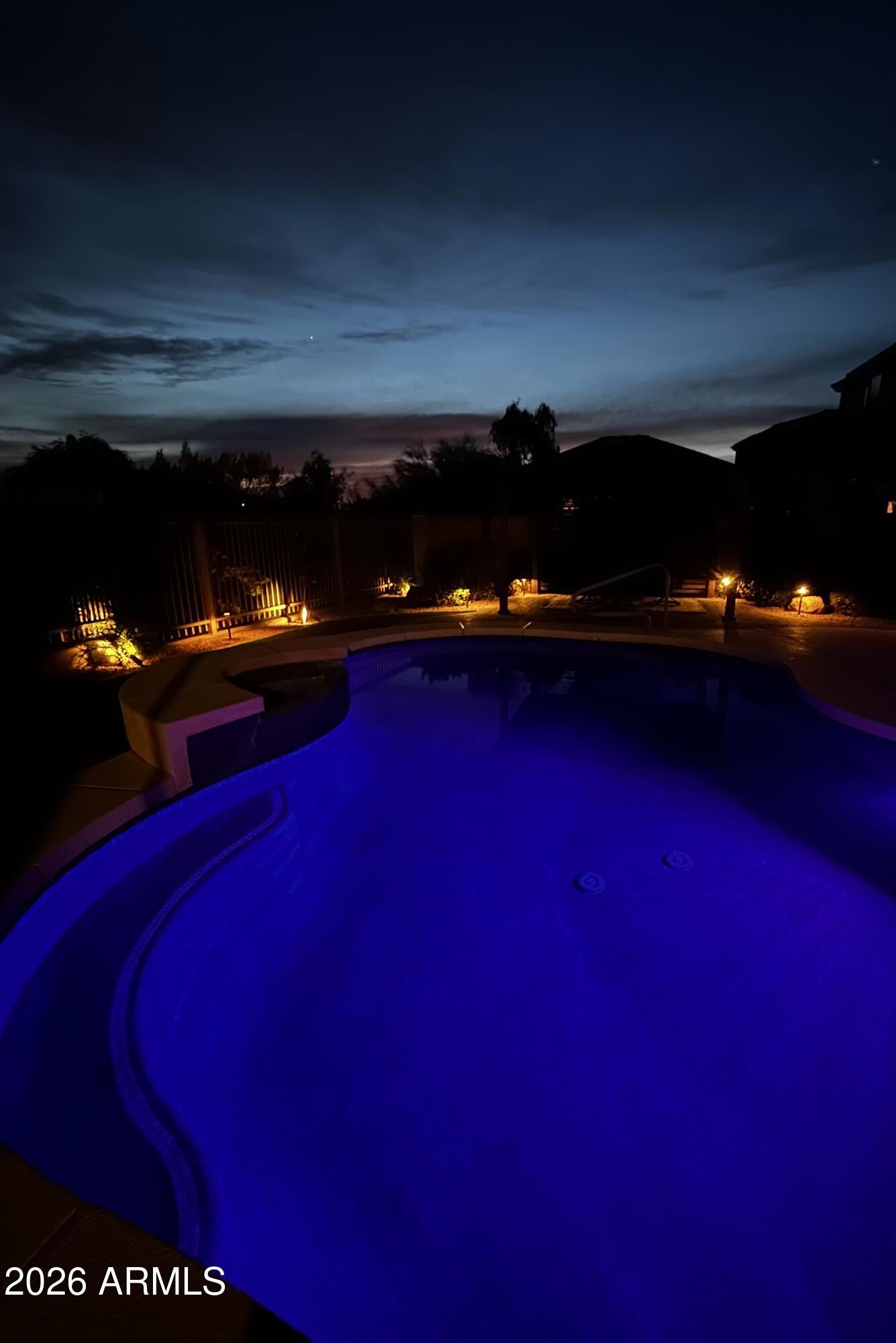 5219 East Hashknife Road Phoenix, AZ 85054 - Photo 33 of 38 a view of an empty room with furniture and lamp
