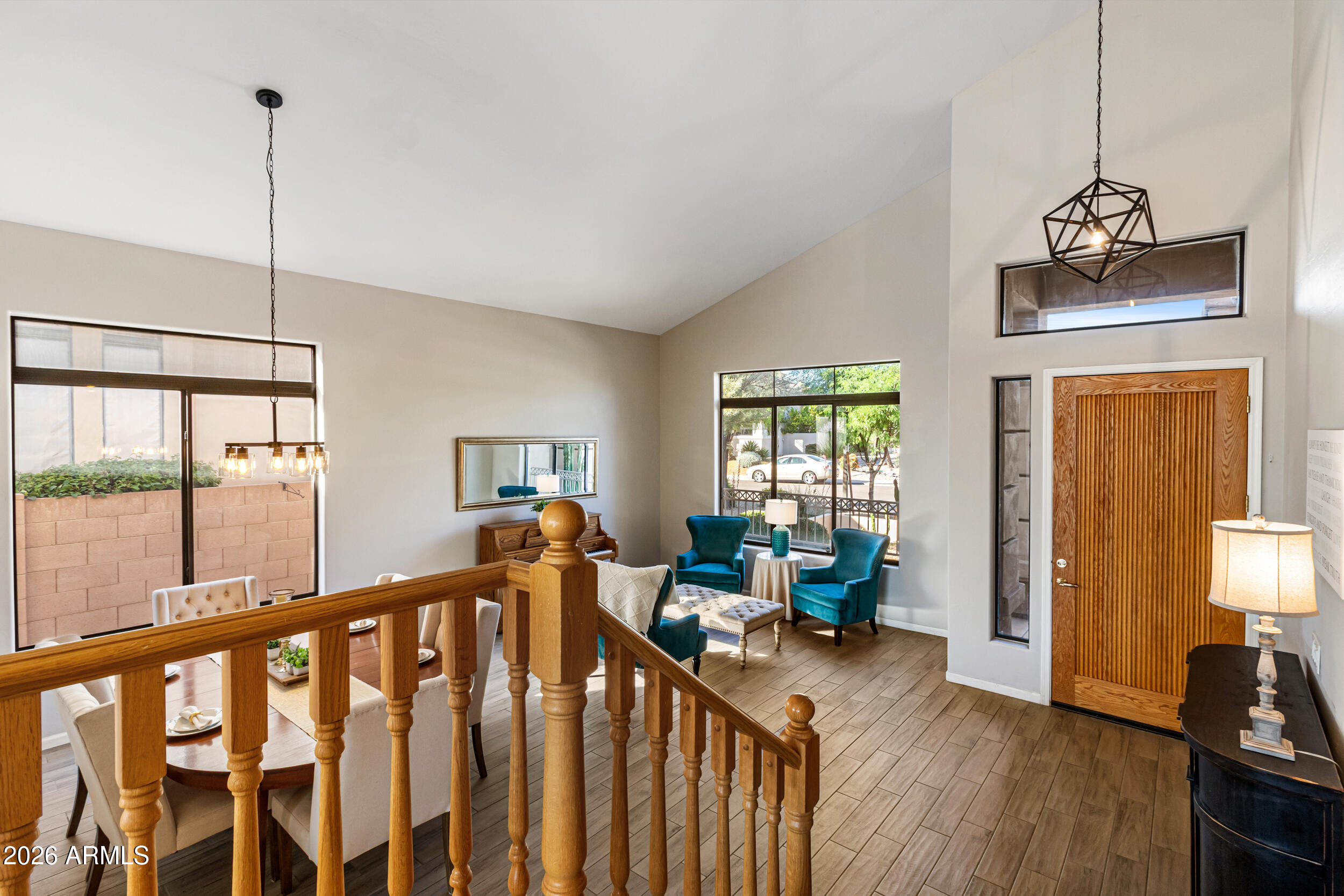 5219 East Hashknife Road Phoenix, AZ 85054 - Photo 5 of 38 a view of a room with window wooden floor and chandelier