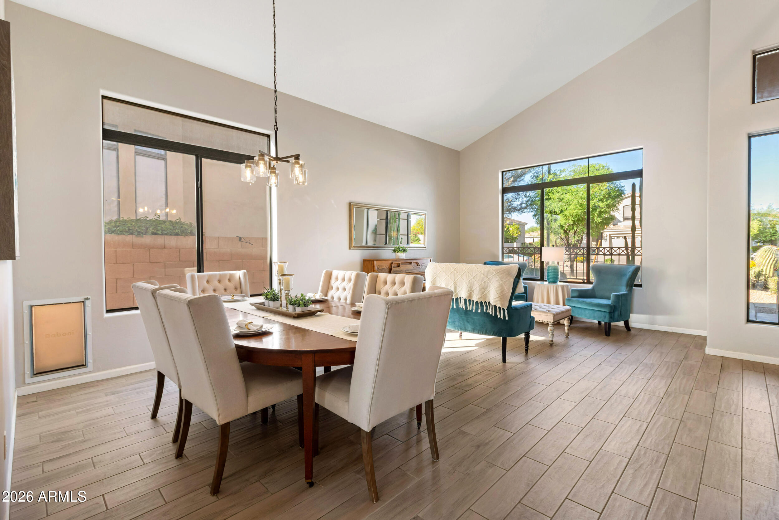 5219 East Hashknife Road Phoenix, AZ 85054 - Photo 6 of 38 a dining room with furniture window wooden floor
