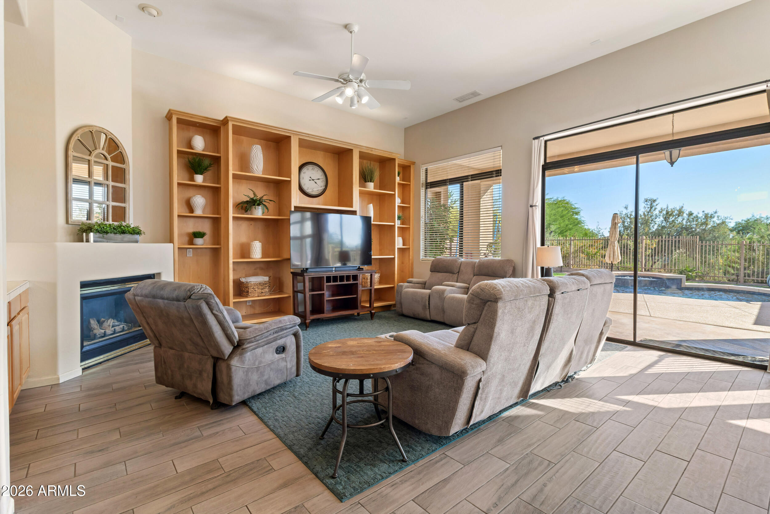 5219 East Hashknife Road Phoenix, AZ 85054 - Photo 8 of 38 a living room with furniture and a large window