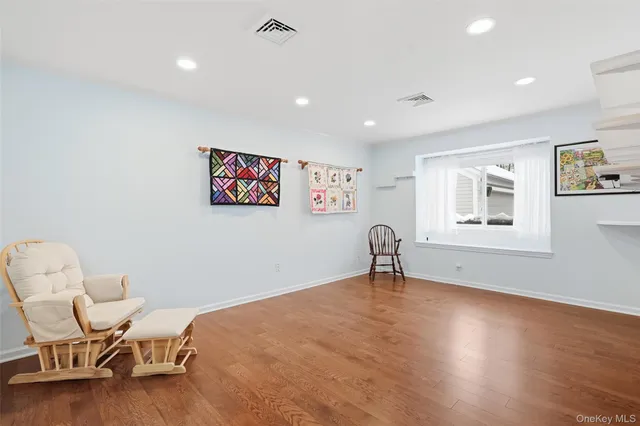 a bathroom with a double vanity sink and a bathtub