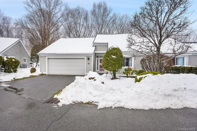 a swimming pool with outdoor seating and yard