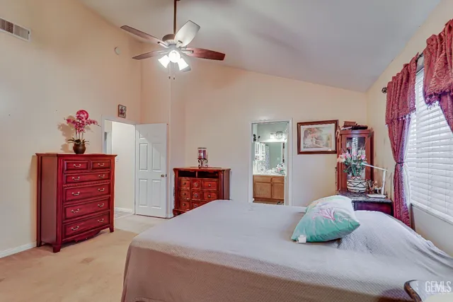 a bed room with a bed and a chandelier