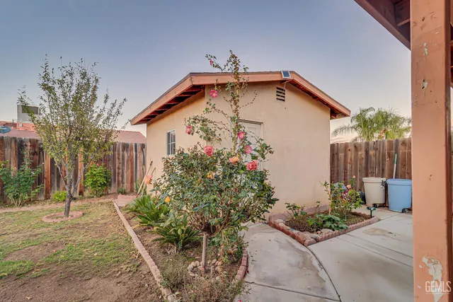 a house with plant in front of it