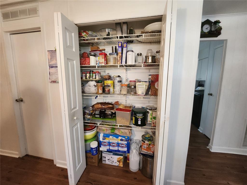 6091 Southeast 114th Street Road Belleview, FL 34420 - Photo 19 of 44 a room with storage and utility