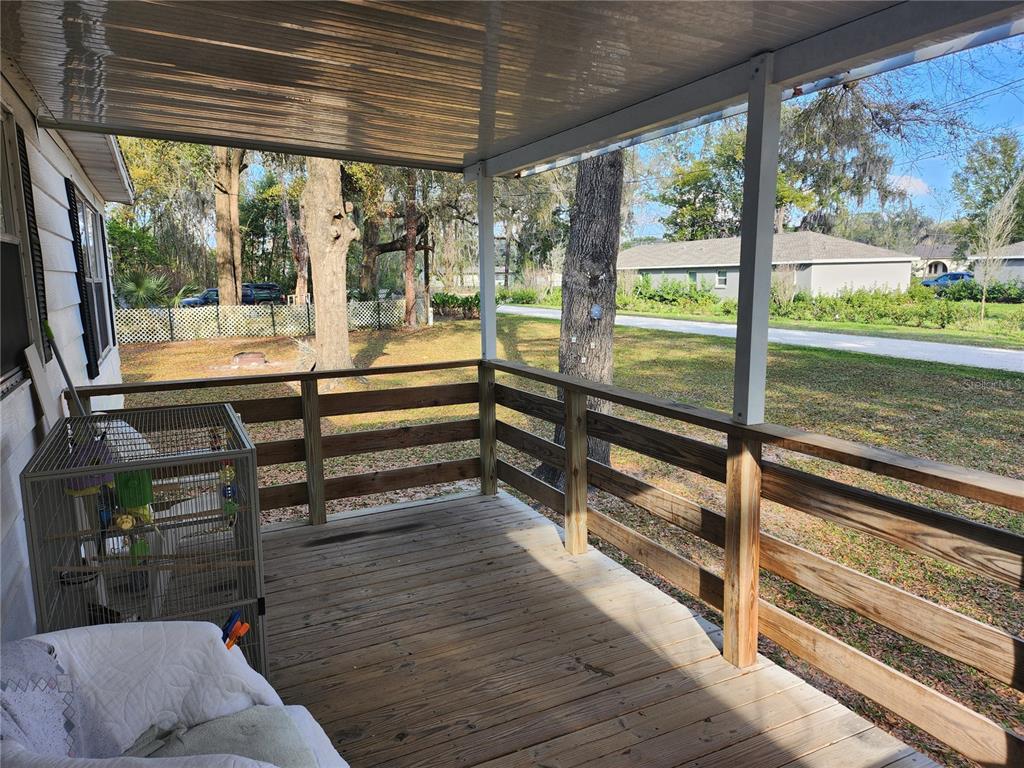 6091 Southeast 114th Street Road Belleview, FL 34420 - Photo 5 of 44 a view of outdoor space with seating area