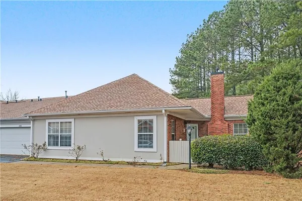a house with trees in the background