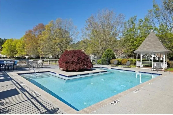 a view of a backyard with sitting area