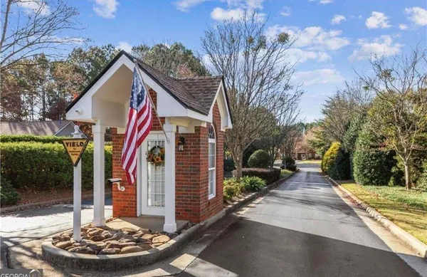 a front view of a house with garden