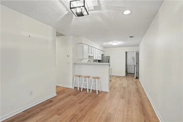 a kitchen with a table and chairs