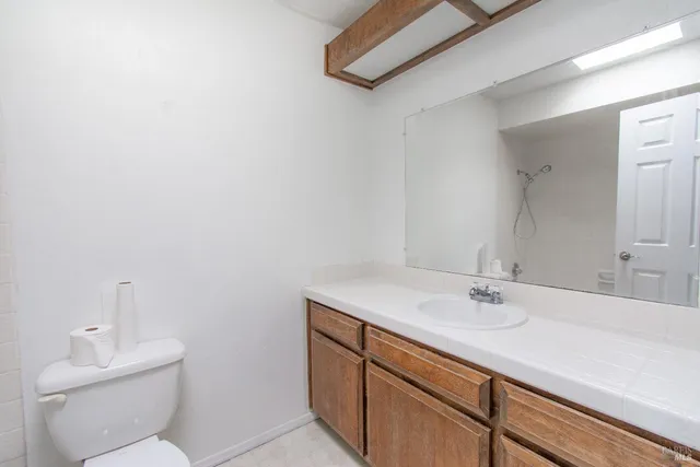a bathroom with a sink toilet and vanity