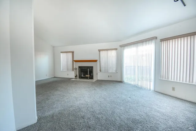 an empty room with fireplace