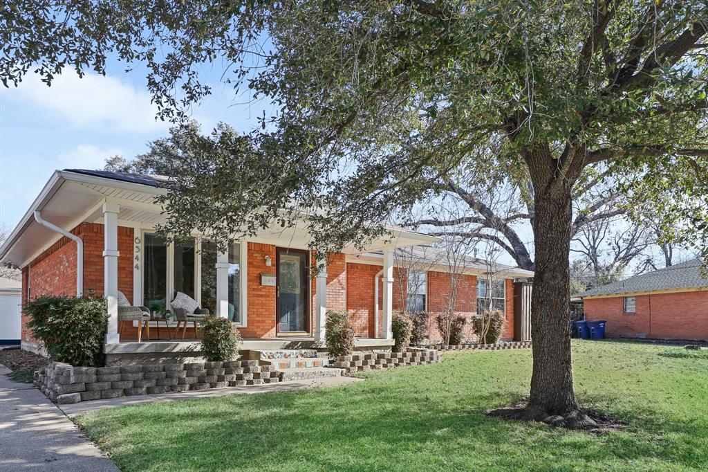 6544 Ridgemont Drive Dallas, TX 75214 - Photo 1 of 1 Beautiful front exterior of home featuring front porch, bay window, long driveway