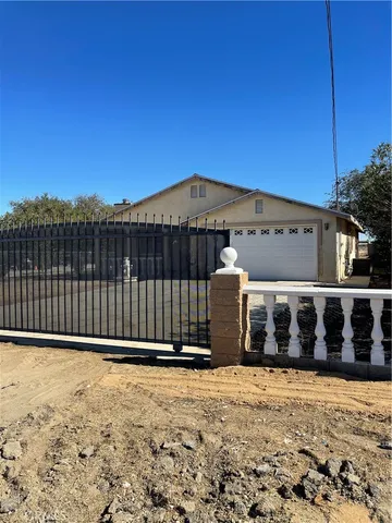 a view of a house with a fence