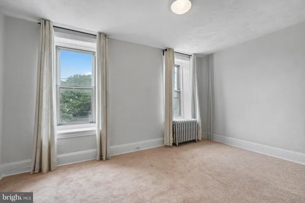 a view of an empty room and window