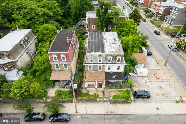 an aerial view of a house with outdoor space