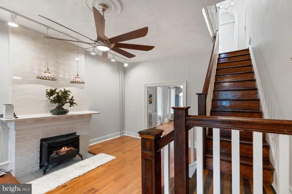a view of a livingroom with furniture and a fireplace